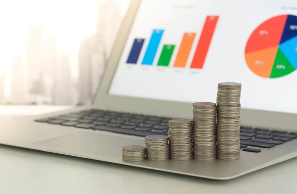 Wealth management concept with coins and chart 1920w